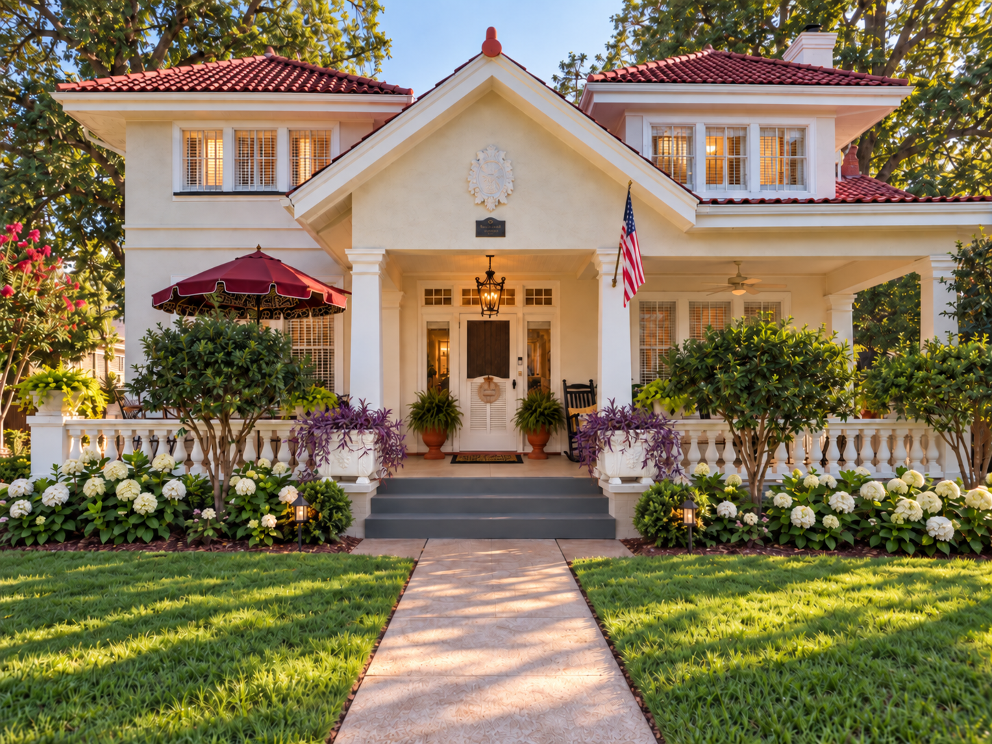 Present-day early morning exterior of The House on Jefferson in Shreveport, Louisiana, with the original plaster planters at the front entrance.
